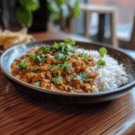 Plate of chicken mince curry with rice.