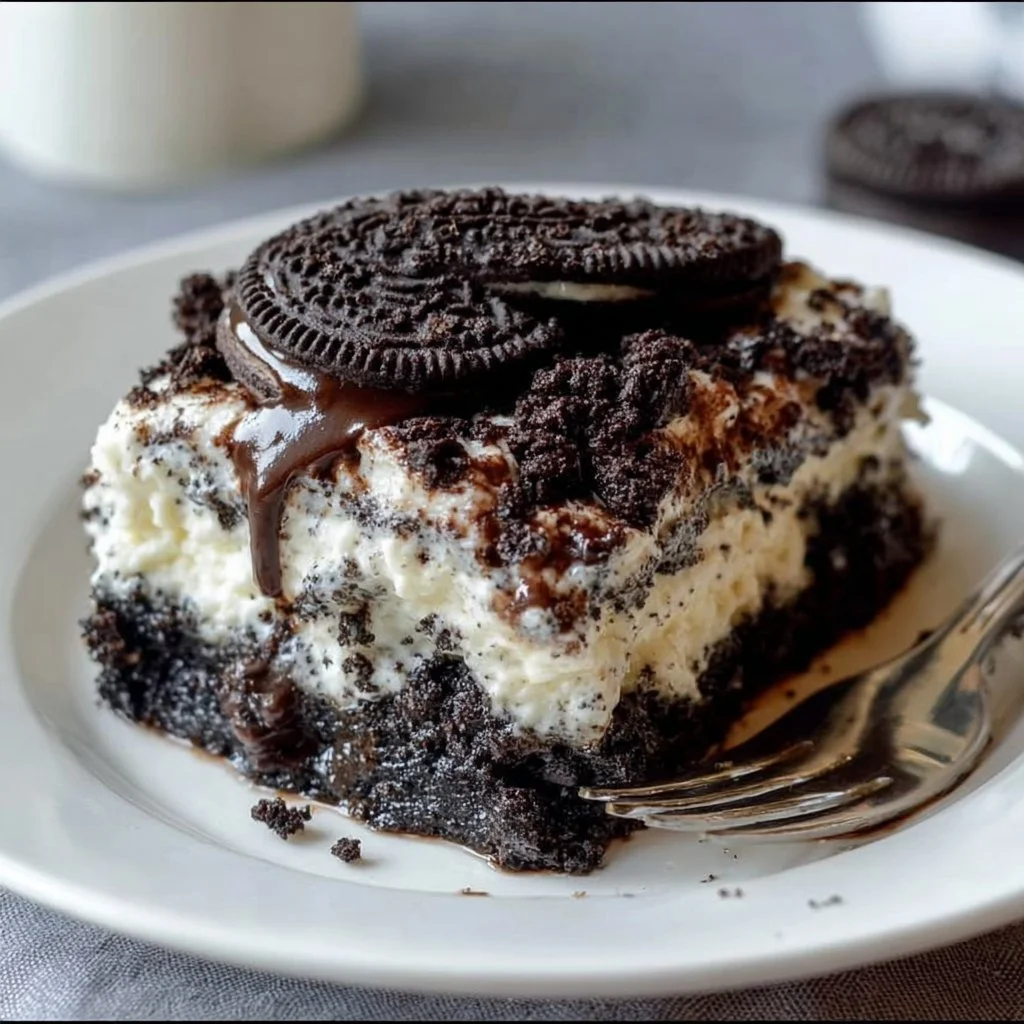 Delicious Oreo Dump Cake topped with crushed Oreos and whipped cream