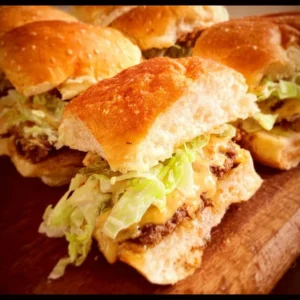 Big Mac Sliders on a platter with fresh ingredients