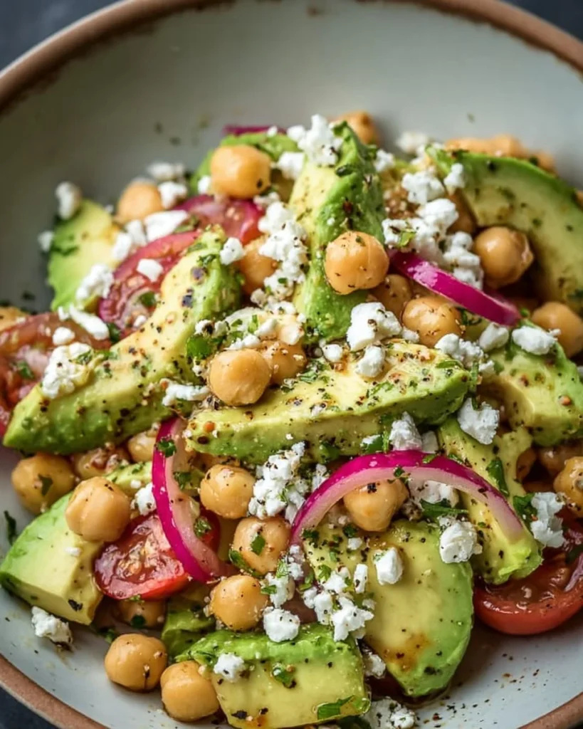 Chickpea Feta Avocado Salad with fresh ingredients in a bowl.