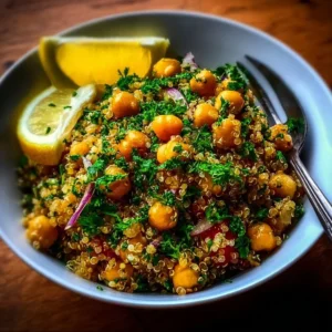 Plate of Lemon Herb Quinoa with Chickpeas garnished with herbs