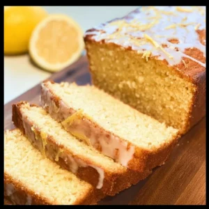 Delicious Almond Flour Lemon Bread topped with lemon zest and sliced lemons