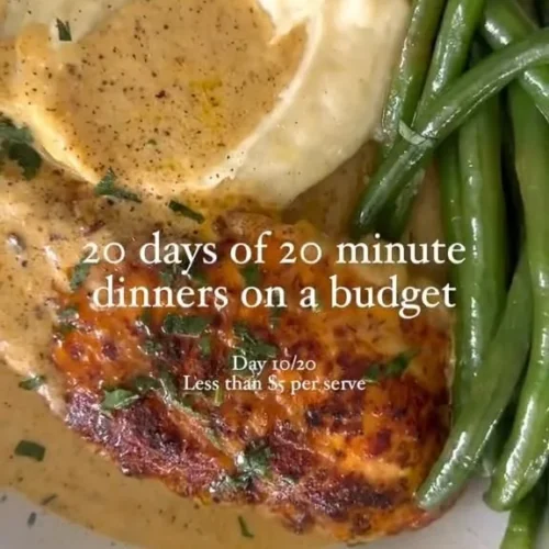 Creamy chicken schnitzel served with a side of vegetables and sauce