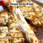 Delicious easy cheesy garlic bread with melted cheese and garlic on crusty bread